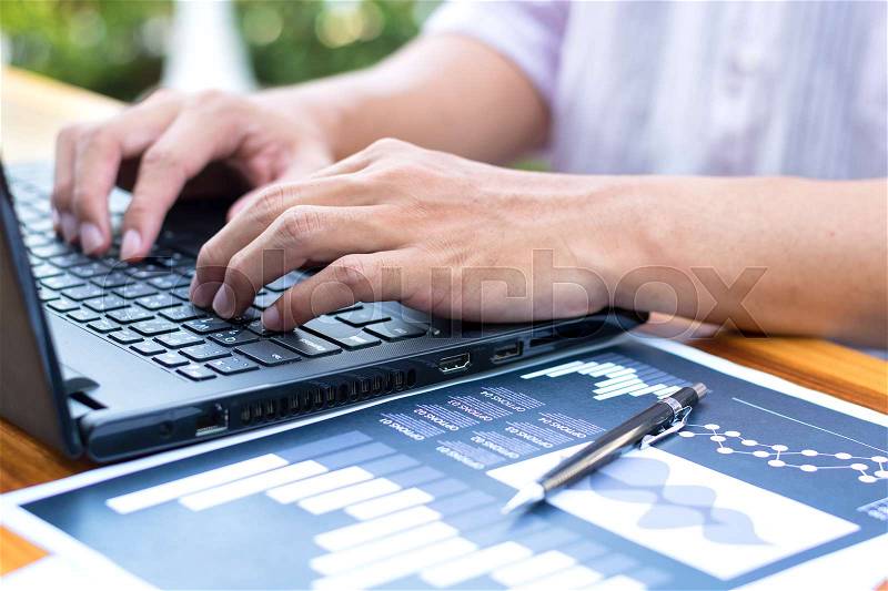 Business technology concept,Business people hands use smart phone and laptop for business analyst project on table ,selective focus, stock photo