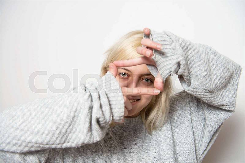 Woman making a hand frame, stock photo