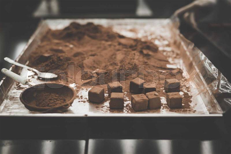 Cocoa powder on chocolate tray, stock photo