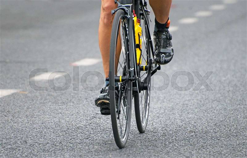 Unrecognizable professional cyclist during the bicycle competition, stock photo