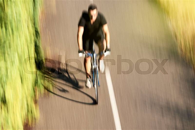 Silhouette of sportive view from above of adult cyclist sport man workout near the European Parliament building in Strasbourg on a calm summer day near Ill river, stock photo