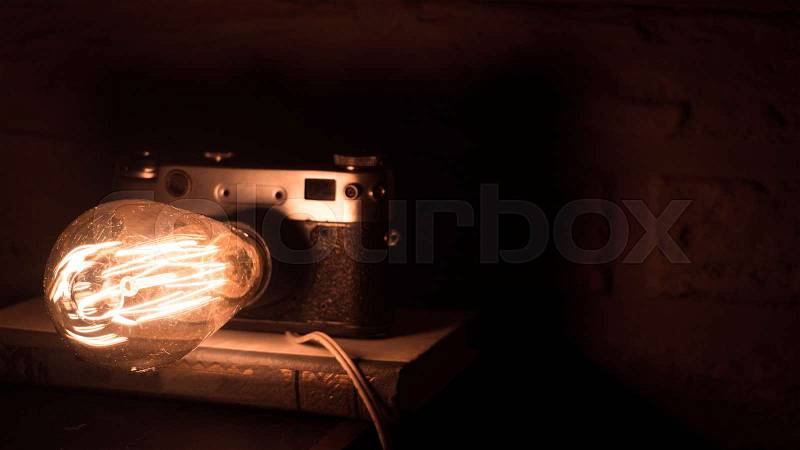 Old vintage camera in the form of a lamp, stock photo