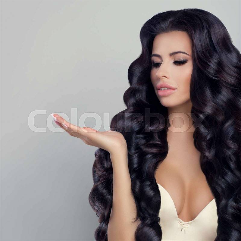 Beautiful Woman Showing her Empty Hand, stock photo
