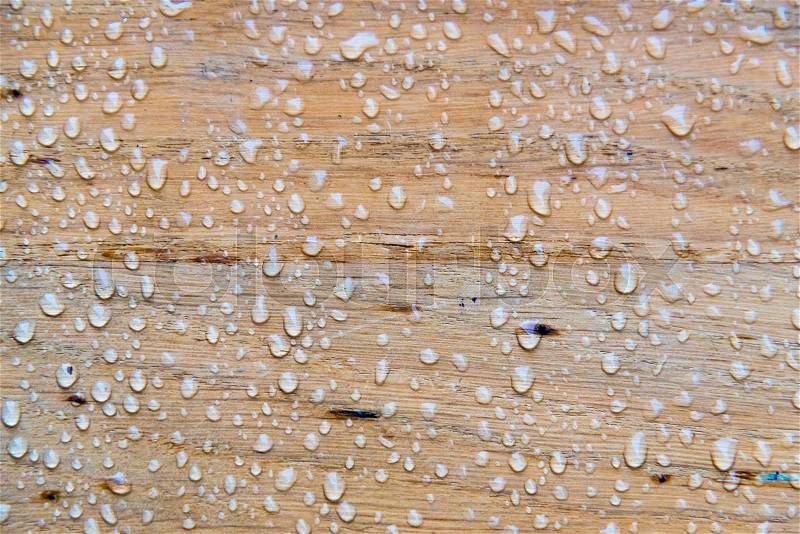 Rain water drops on vintage wooden surface, stock photo