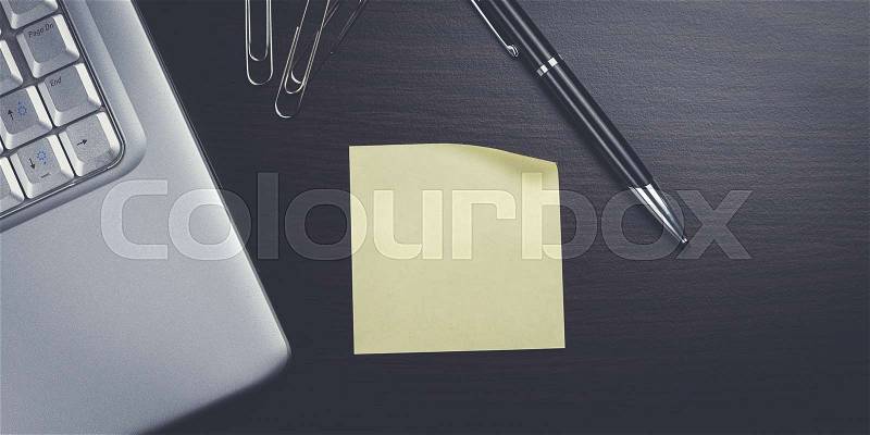 Blank sticker and laptop on the table, stock photo