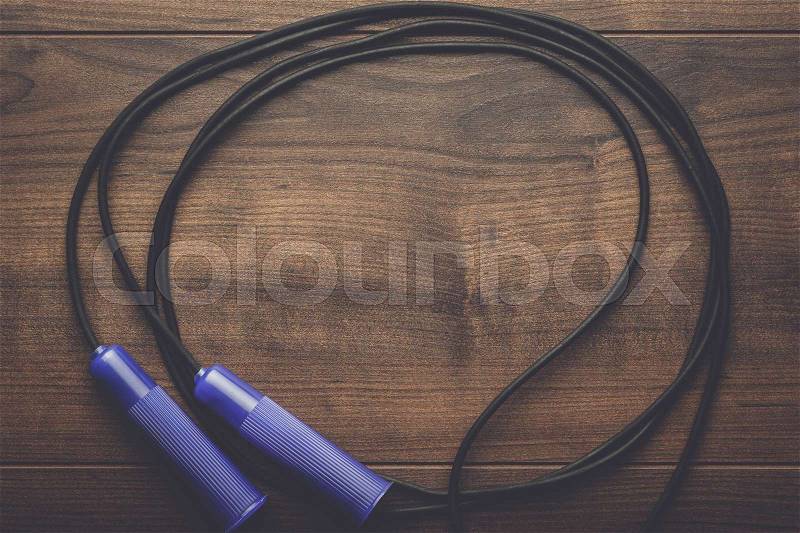 Skipping rope for an exercise on the table, stock photo