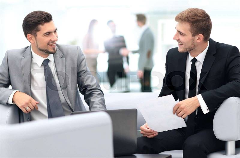 Image of business partners discussing documents and ideas at mee, stock photo