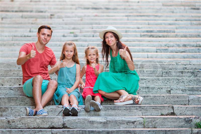 Family vacation in Europe. Parents and kids on Spanish steps in Rome, stock photo
