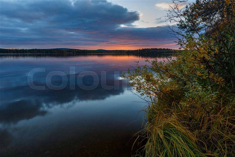 Autumn sunset on the lake, Finland, stock photo