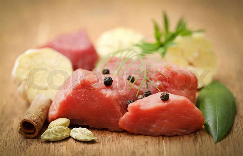 Raw beef with garlic and other spices, stock photo