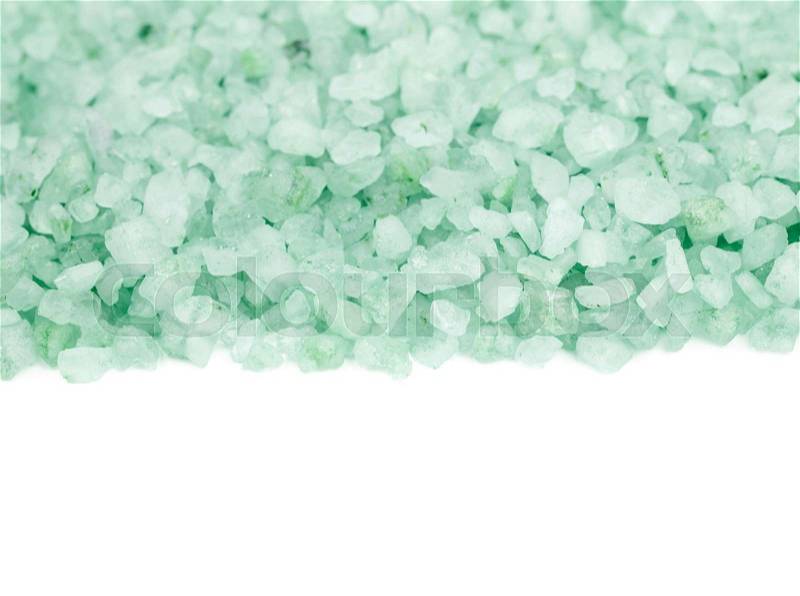 Pile of salt crystals isolated over the white background, close-up crop fragment as a copyspace backdrop composition, stock photo