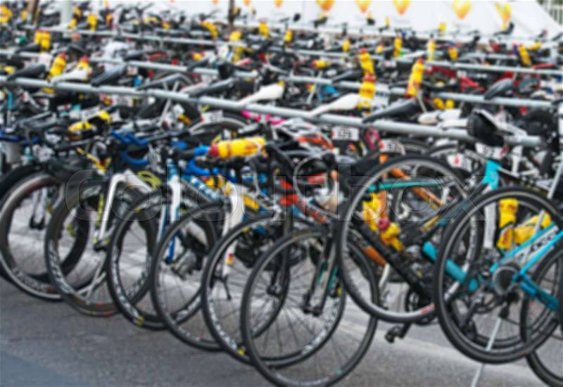 Many bicycles after race on the street. Blurred image, stock photo
