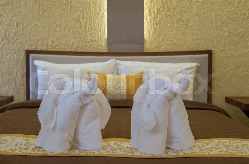 Elephant towel, art decoration in resort bedroom, stock photo