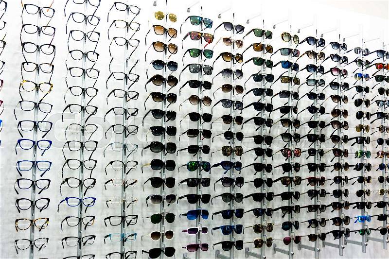 Glasses background. glasses displayed. eye glasses on the shelf. eyeglass at an opticians store, stock photo