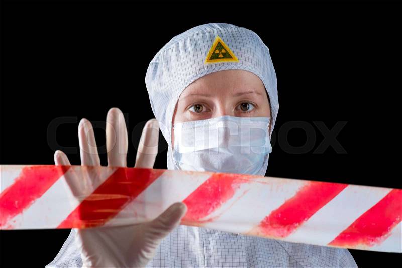 Woman in protective clothing working in the infected area, shows fencing the area, stock photo