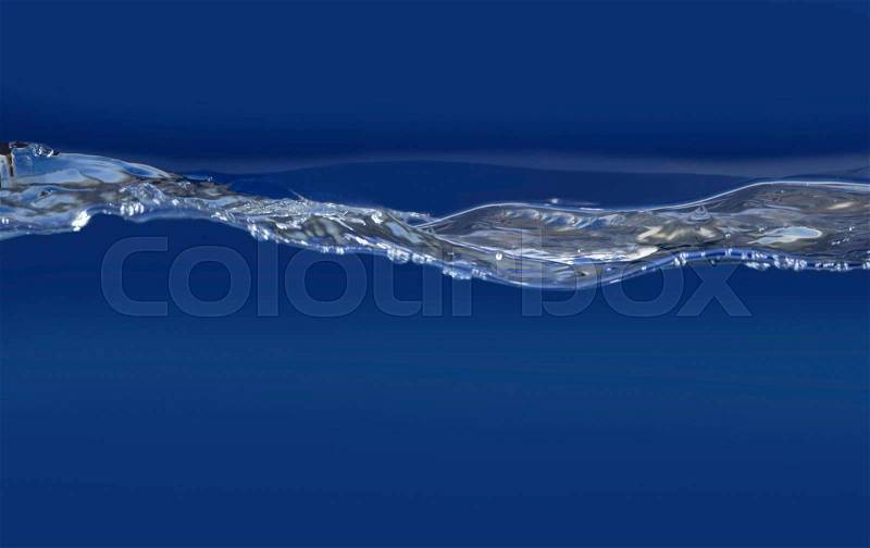 Wavy water surface detail in blue ambiance, stock photo