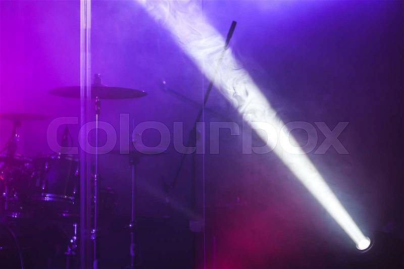 Ray of scenic spot light over blurred csenic background, stage illumination equipment, stock photo