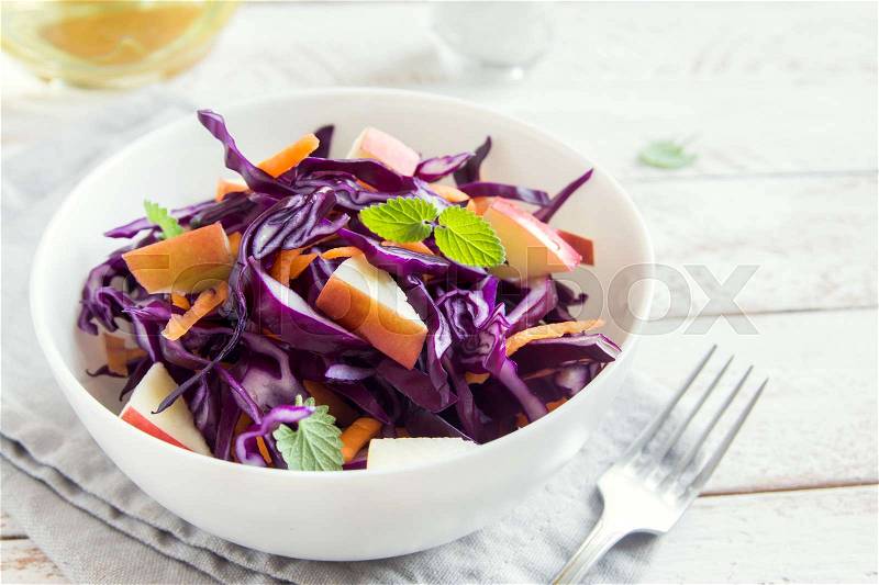 Red Cabbage Coleslaw Salad with Carrots and Apples - healthy diet, detox, vegan, vegetarian, vegetable spring salad, stock photo