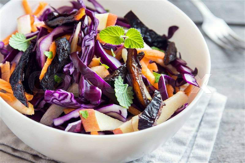 Red Cabbage Coleslaw Salad with Carrots, Apples and Prunes - healthy diet, detox, vegan, vegetarian, vegetable spring salad, stock photo