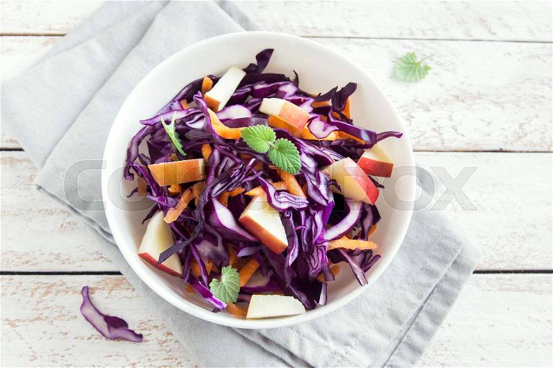 Red Cabbage Coleslaw Salad with Carrots and Apples - healthy diet, detox, vegan, vegetarian, vegetable spring salad, stock photo