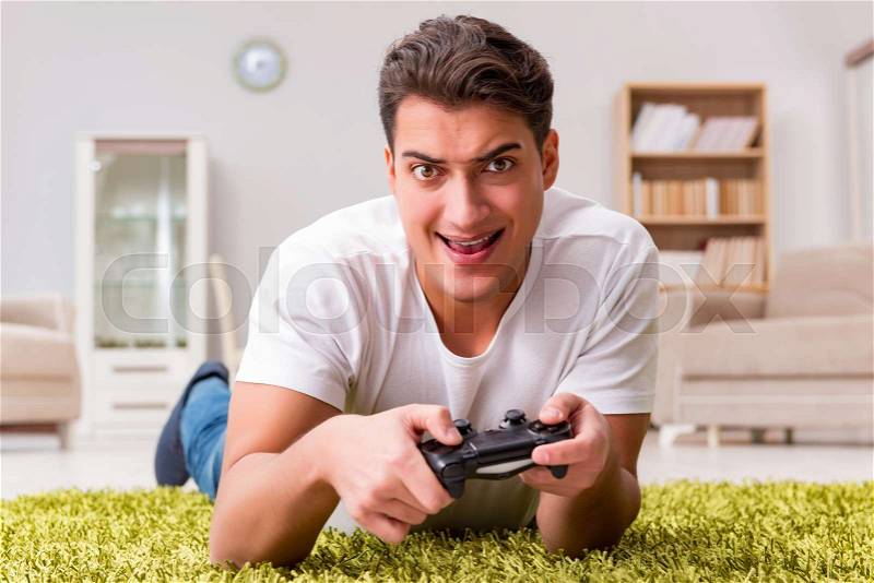 Man addicted to computer games, stock photo