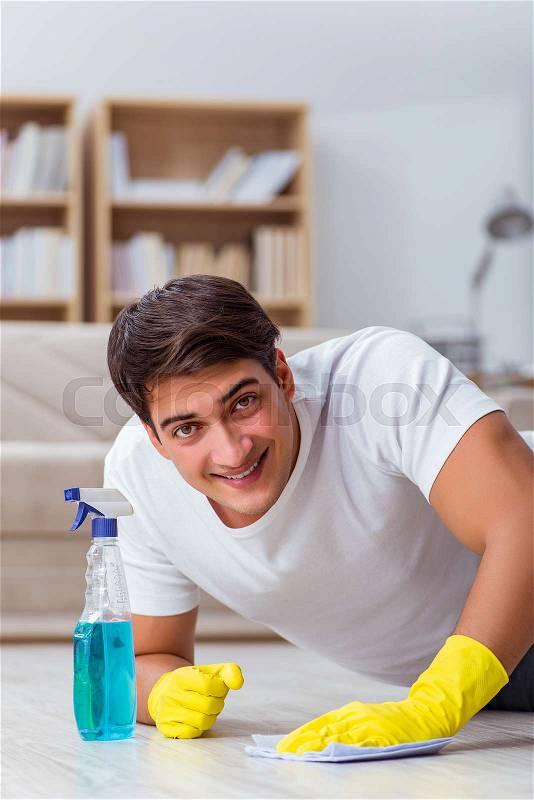 Man husband cleaning the house helping wife, stock photo