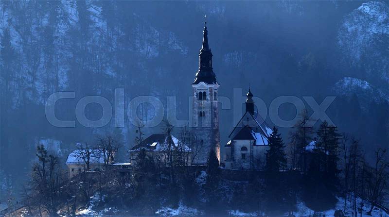 Dark church on the hill cold winter evening, stock photo