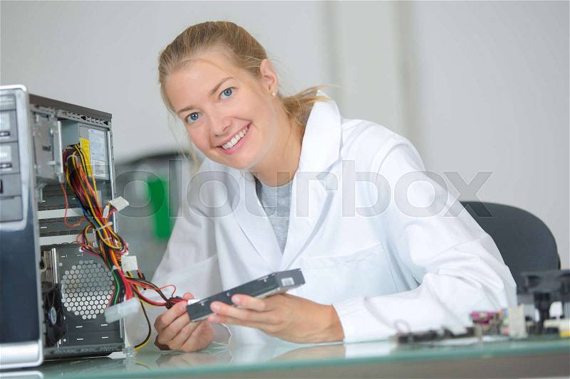 Portrait of female computer technician, stock photo