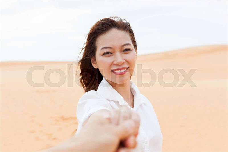 Beautiful Woman In Desert Young Asian Girl Portrait Happy Smile Hold Hand Sand Dune Background, stock photo