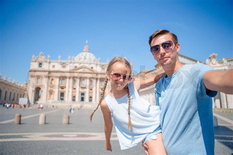 Happy family background St. Peter\'s Basilica church in Vatican city taking selfie, stock photo