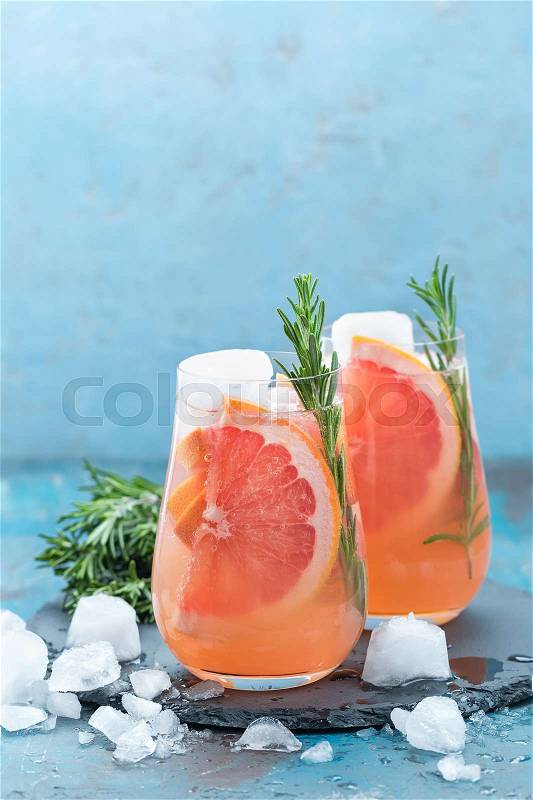 Grapefruit and rosemary gin cocktail, refreshing drink with ice, stock photo