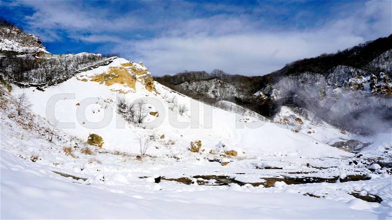 Noboribetsu onsen snow mountain bluesky hell valley winter national park in Jigokudani, Hokkaido, Japan, stock photo