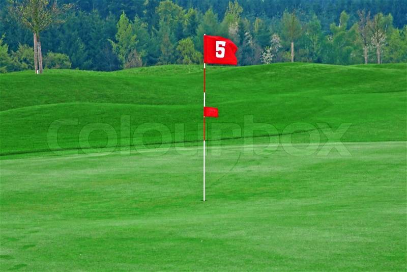 Red flag on the golf course, stock photo