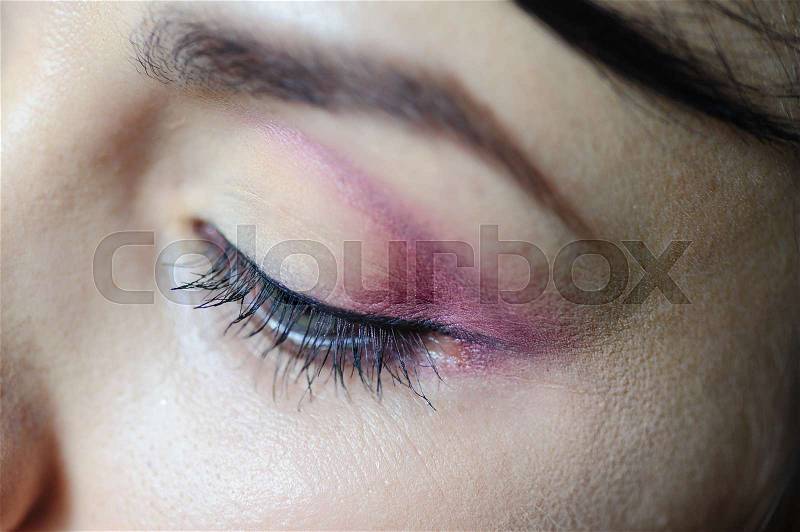 Female eye with a light make-up closeup, stock photo