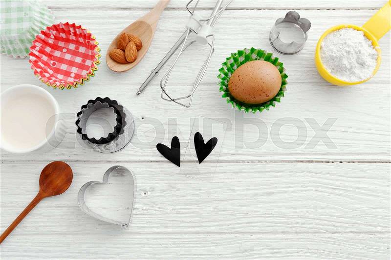 Baking background with baking ingredients and tool on wooden table, stock photo
