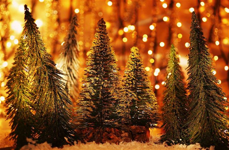 Christmas tree forest, holiday background with winter ornament & abstract defocus lights decoration, stock photo