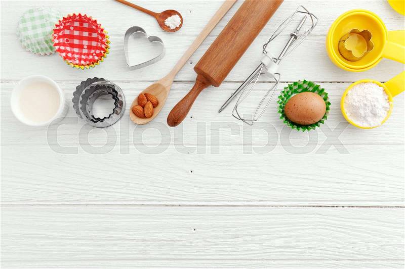Baking background with ingredients and baking utensils, stock photo