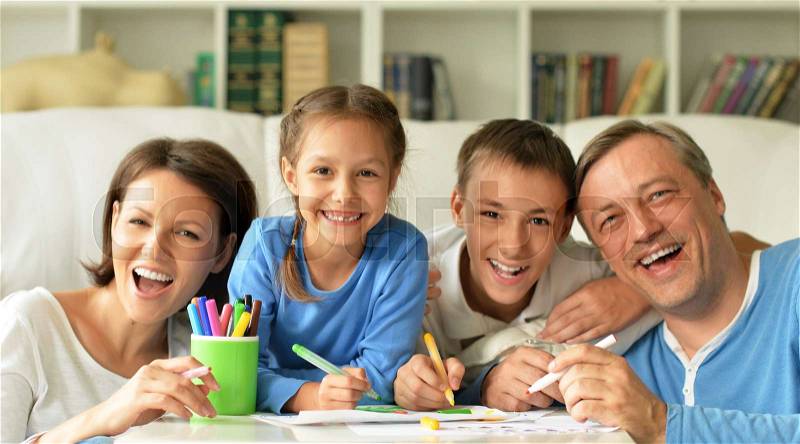 Big happy family drawing together at home, have fun, stock photo