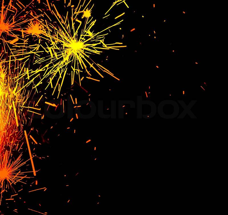 Bright border of firework sparks isolated on black background, decorative abstract holiday lights, christmas and new year fun, stock photo