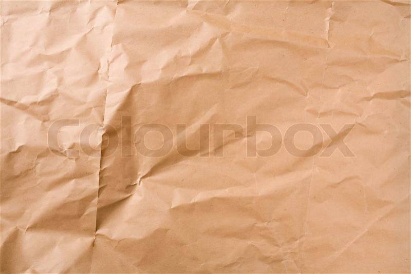Creased brown packaging paper sheet texture background, stock photo