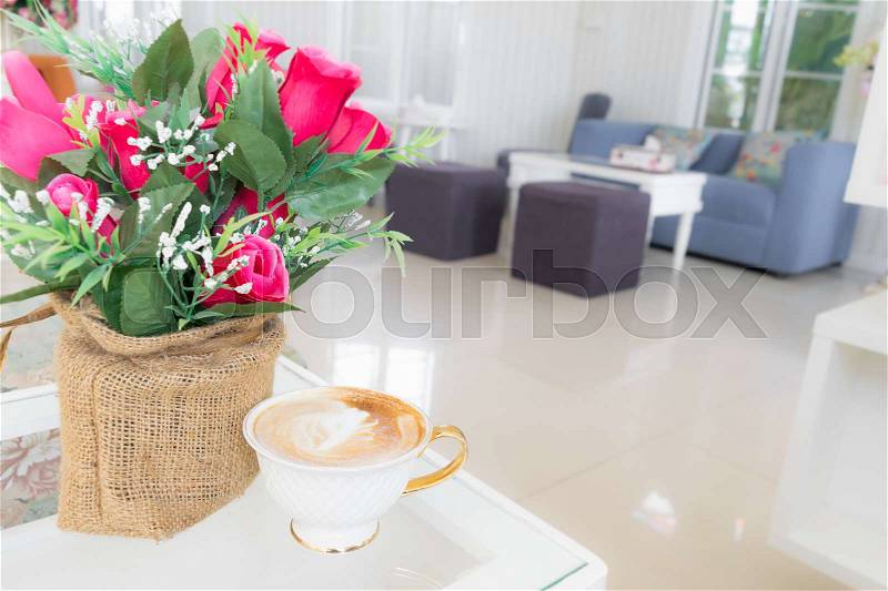 Cup of coffee on the table with flower in cafe, Joyful with coffee time concept, stock photo