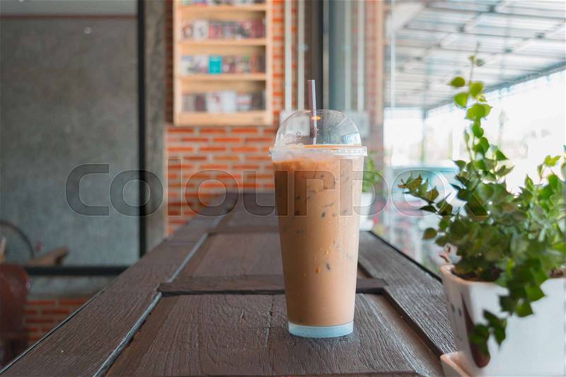 Glass of cool coffee on the table in cafe, Joyful with coffee time concept, stock photo