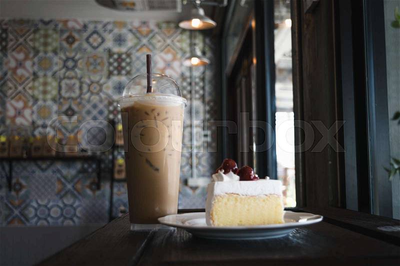 Cherry cake with glass of coffee on the table in cafe, Joyful with coffee time concept, stock photo