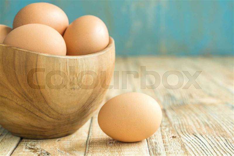 Chicken Egg on the wood old background, stock photo