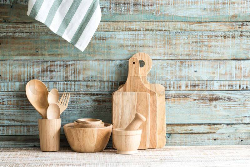 Kitchen cooking utensils in wood storage on the wood background, stock photo