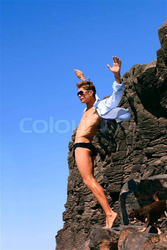Man on the edge of the cliff, stock photo