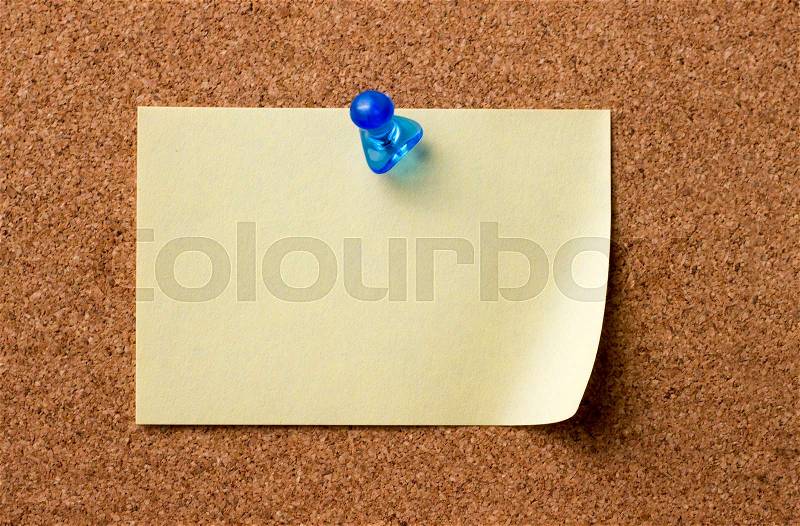 Blank adhesive label pinned on bulletin board - horizontal image, stock photo