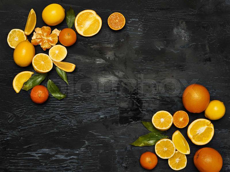 The group fresh fruits against black background, stock photo