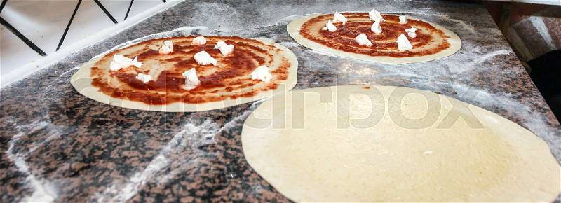 Pizza ready for the wood oven, stock photo