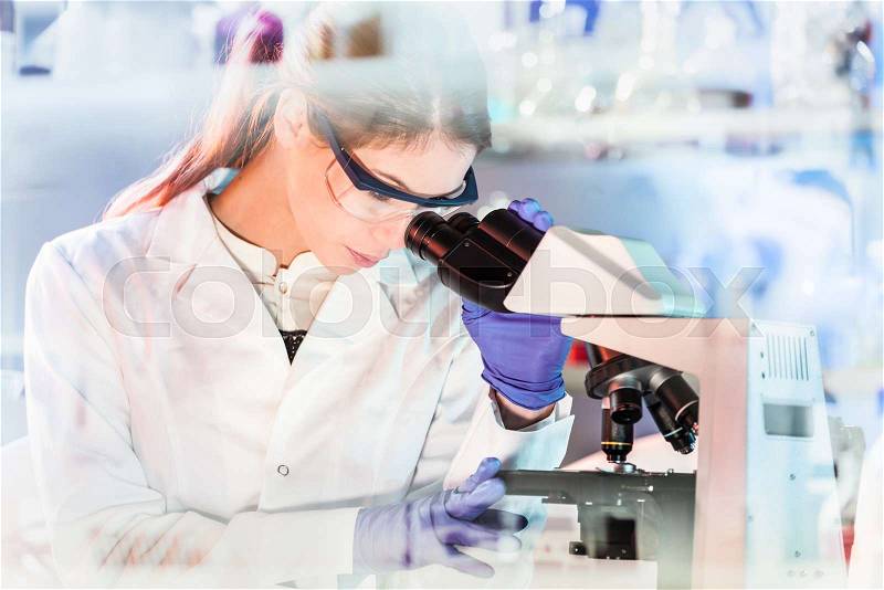 Life science female researcher microscoping in scientific genetic laboratory. Healthcare and biotechnology, stock photo